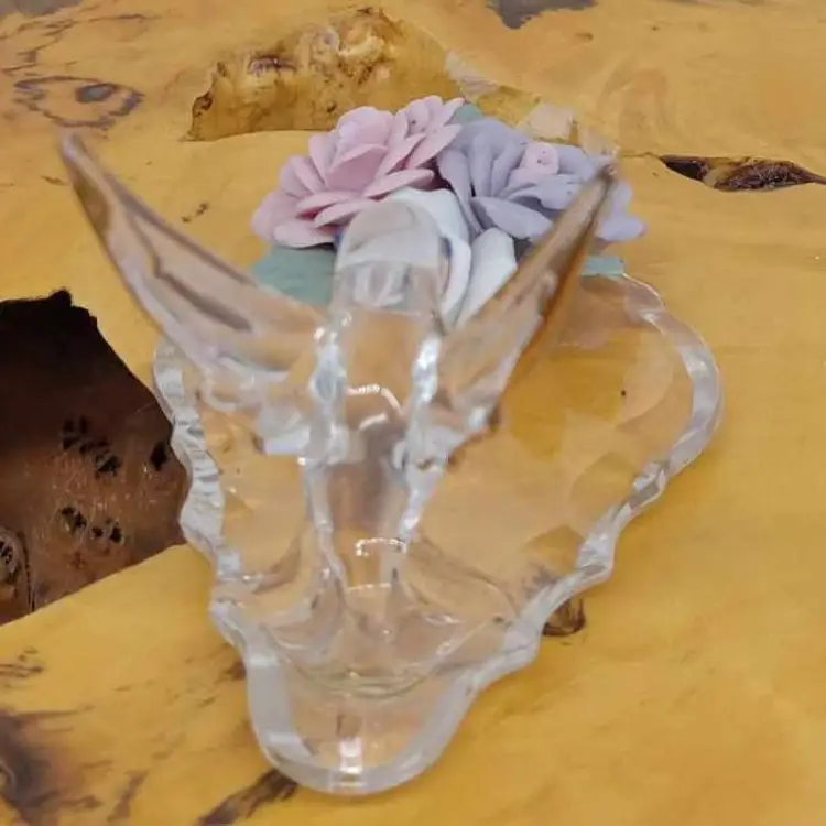 Blown glass hummingbird, porcelain flowers, prism, figurine