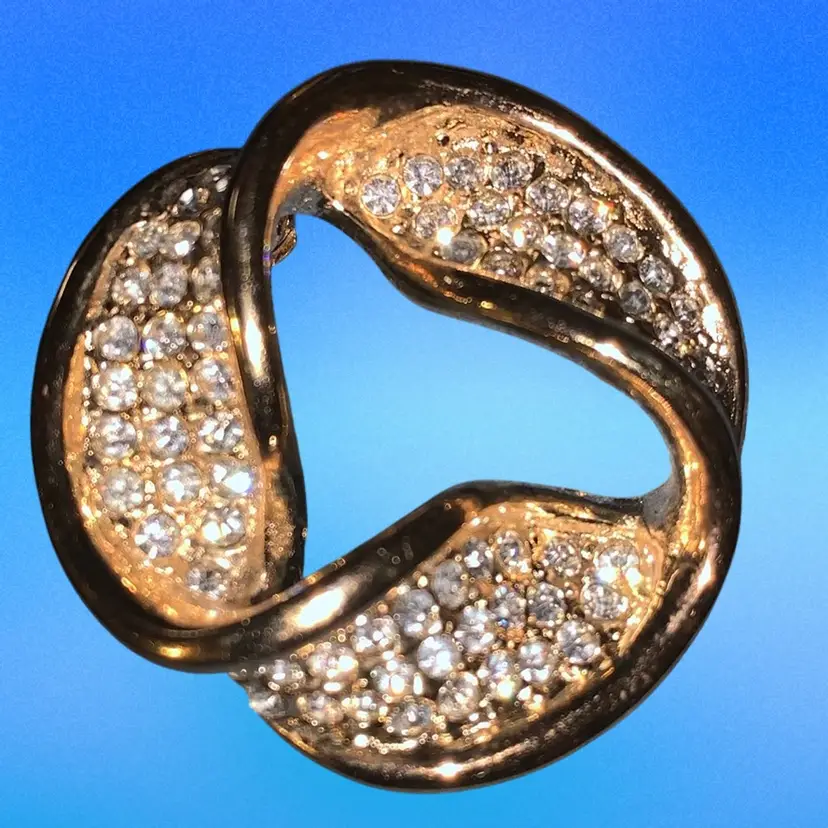 Roman: Gold Tone Circle Swirl Brooch With Rhinestones