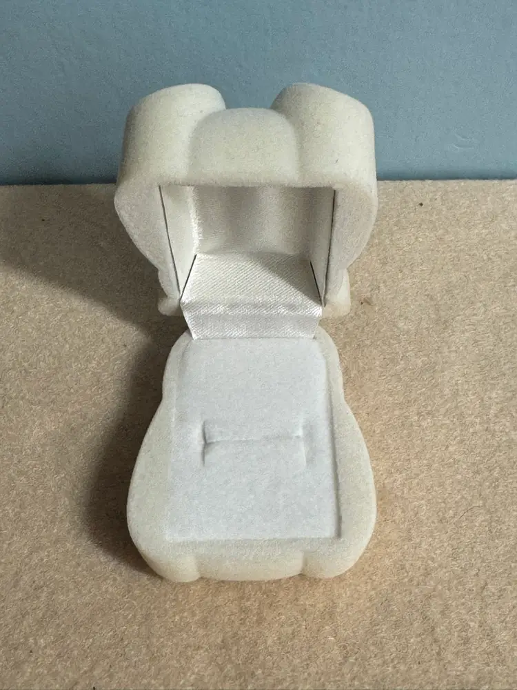 Flocked polar bear jewelry box with a red bow tie