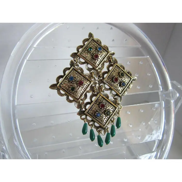 Vintage Sarah Coventry Temple of Lights brooch pin with an articulated style