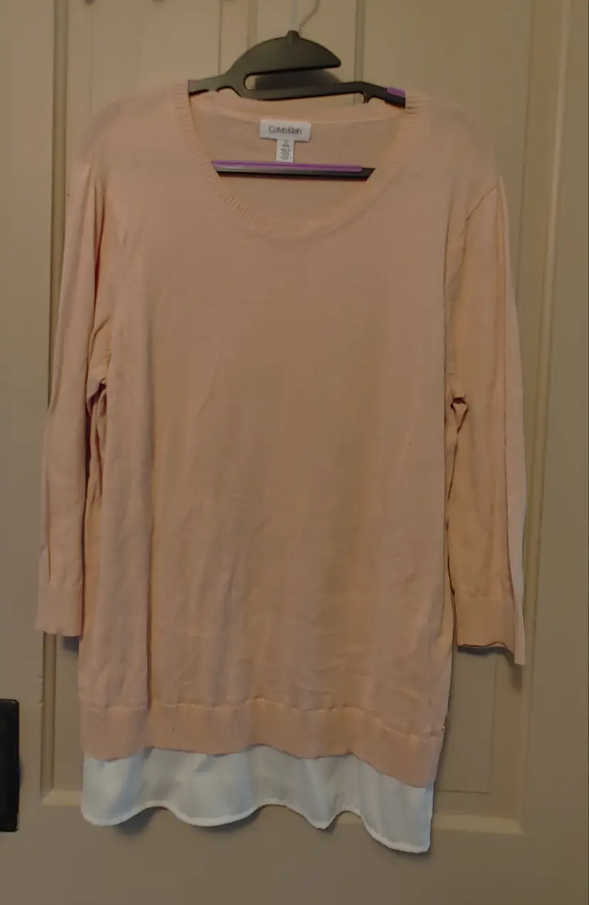 Top- Brand: Calvin Klein. Size Large. Pink top with faux white undershirt. Material- 60% cotton, 40% viscose. No callouts.