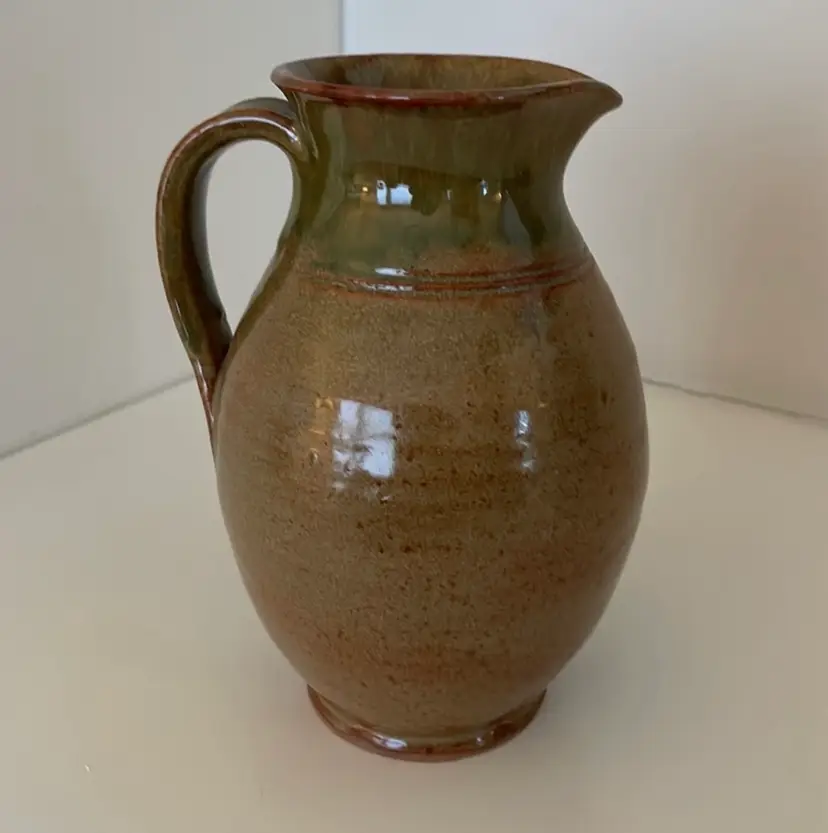 Sturbridge Village, handmade pitcher in browns and green with shiny glaze. Very Nice Condition!