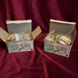 Vintage Centurion Collection Napkin Rings silver gold tone Silverplate 2 Sets Of 4.  Still in original packaging!