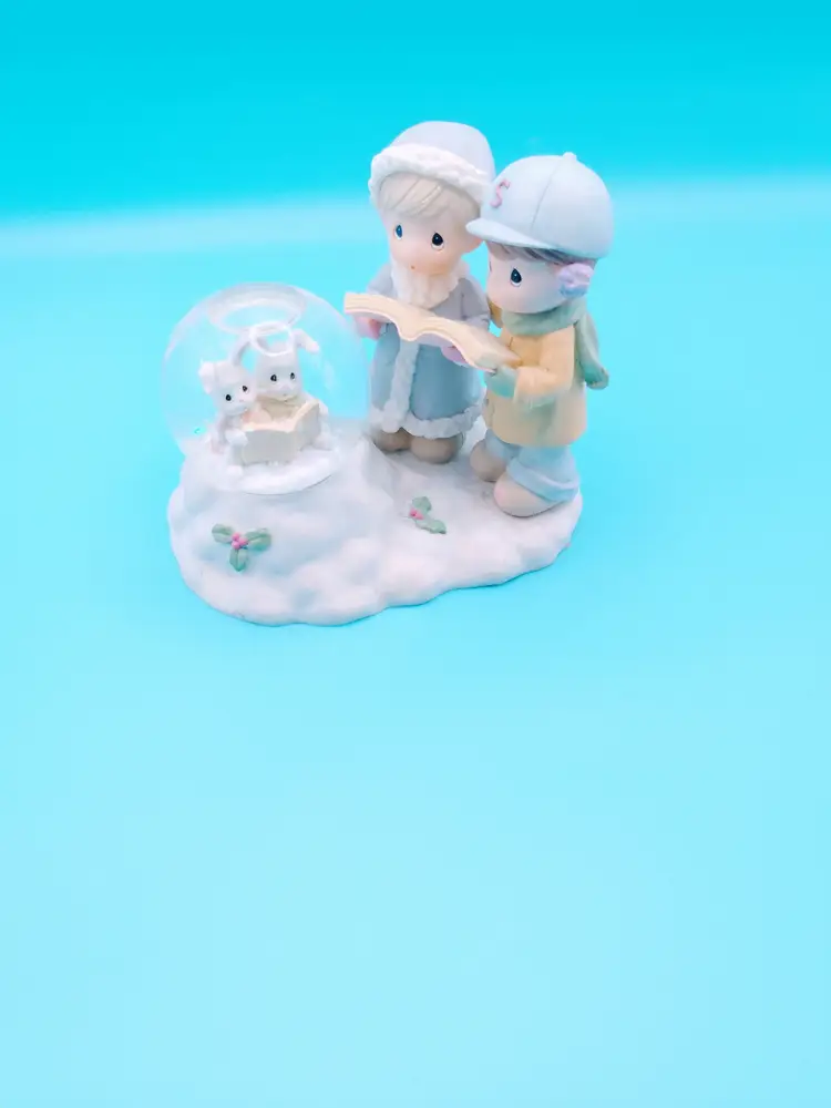 Precious Moments " Christmas Caroling Bunnies," 1999.