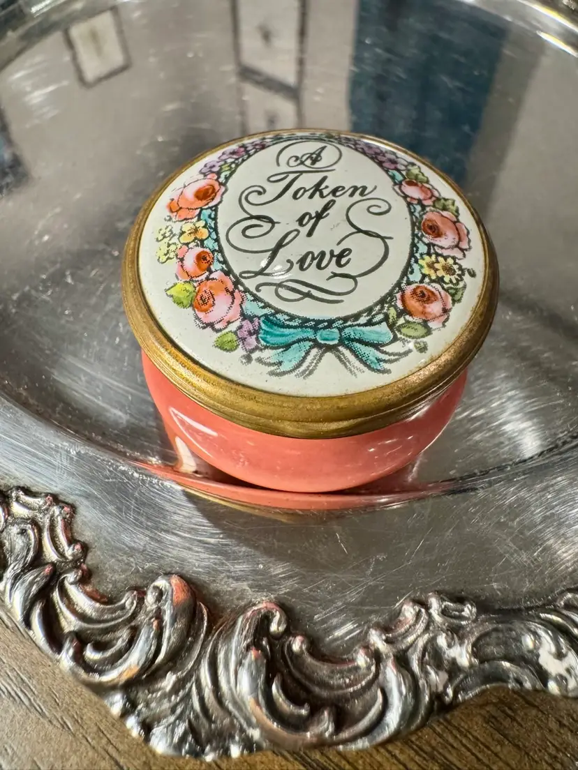 1.25” tall 2” wide, Bilston & Battersea Enamels for Halcyon Days hinged trinket case in pink,"Token of Love" design