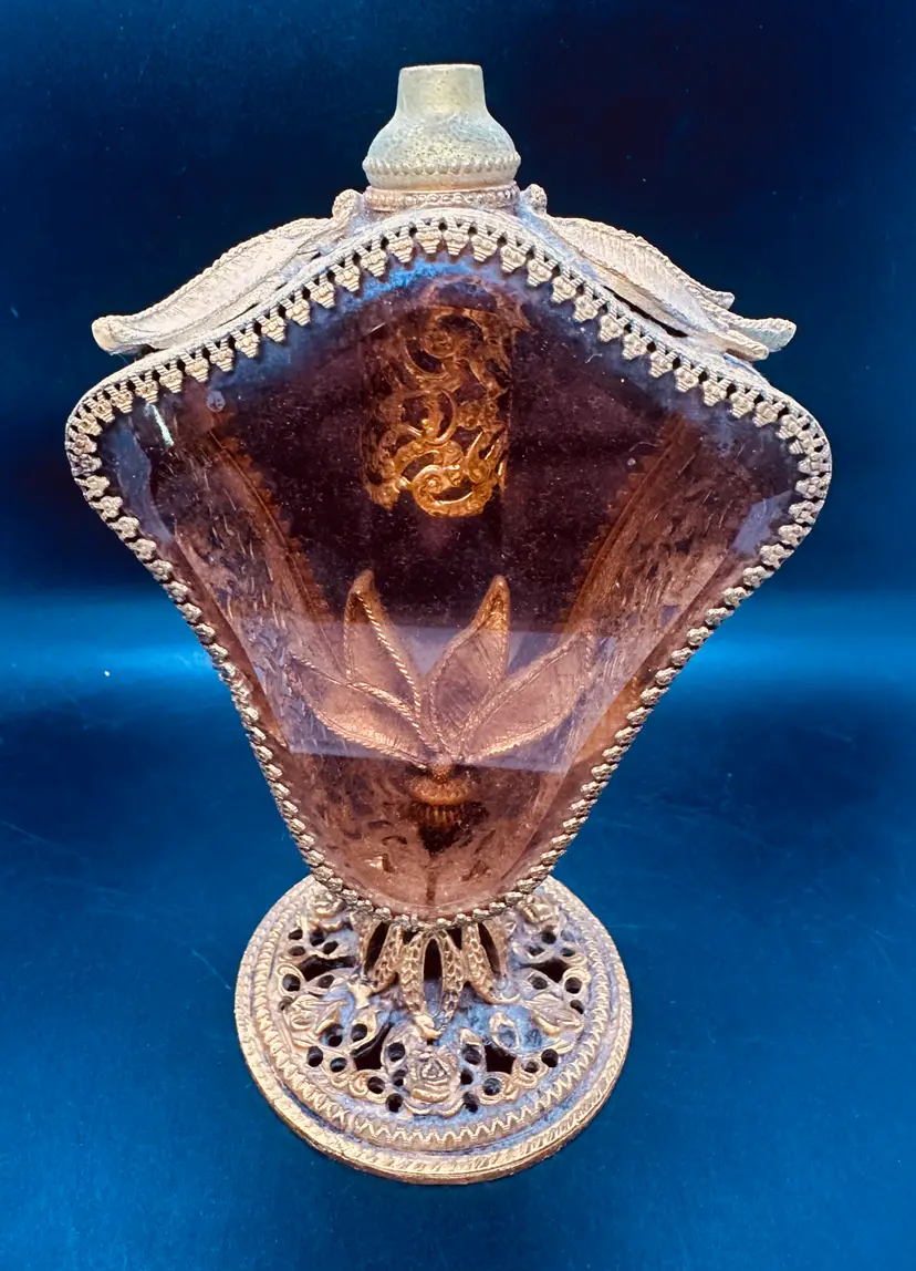 44. VTG Ormolu perfume bottle with a beveled amber glass reservoir and gold gilt filigree work