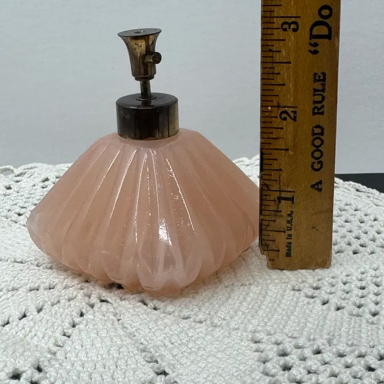 1950’s frosted pink glass perfume atomizer bottle with a metal pump by I. W. Rice & Co.