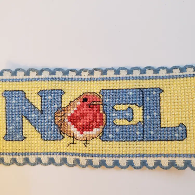 New Cross-stitched bookmark Christmas themed "Noel" on Ribband with blue trim.