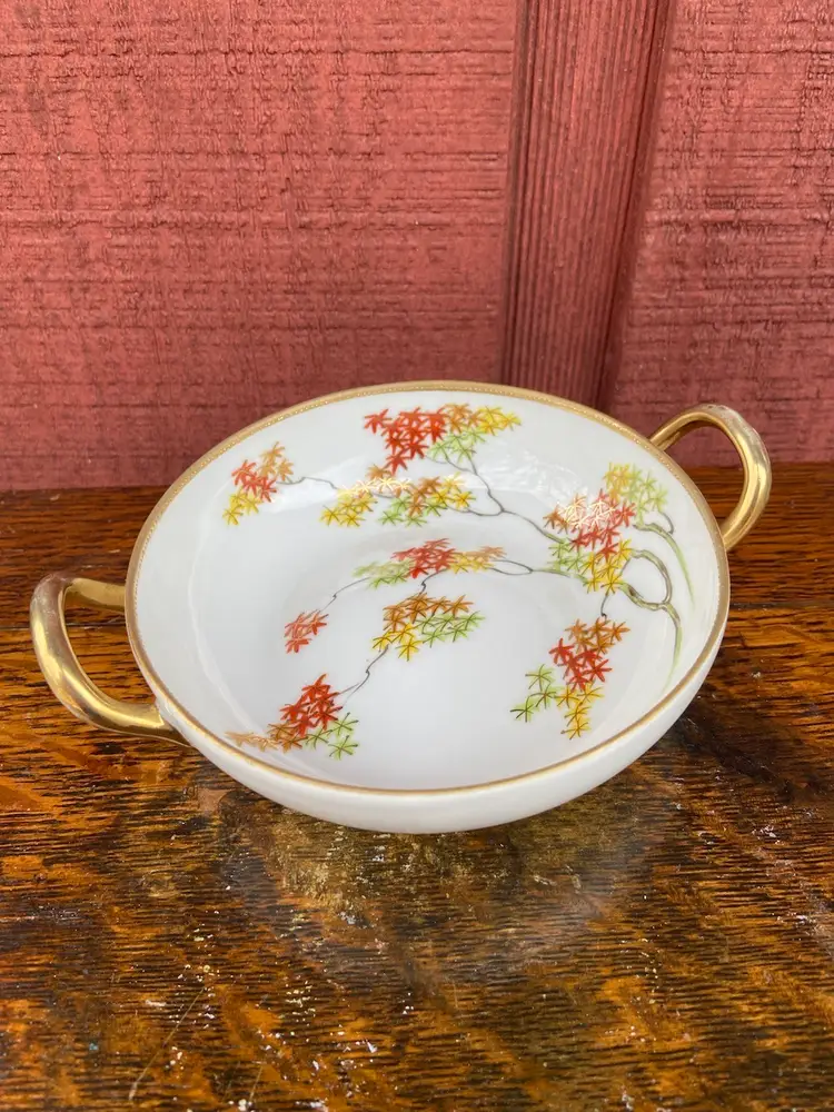 Hand-painted Nippon Bowl. Interior Is Painted Tree Branches With Autumnal-colored Leaves. Rimmed With Textured, Decorative Gold Paint. Gold-painted Handles.