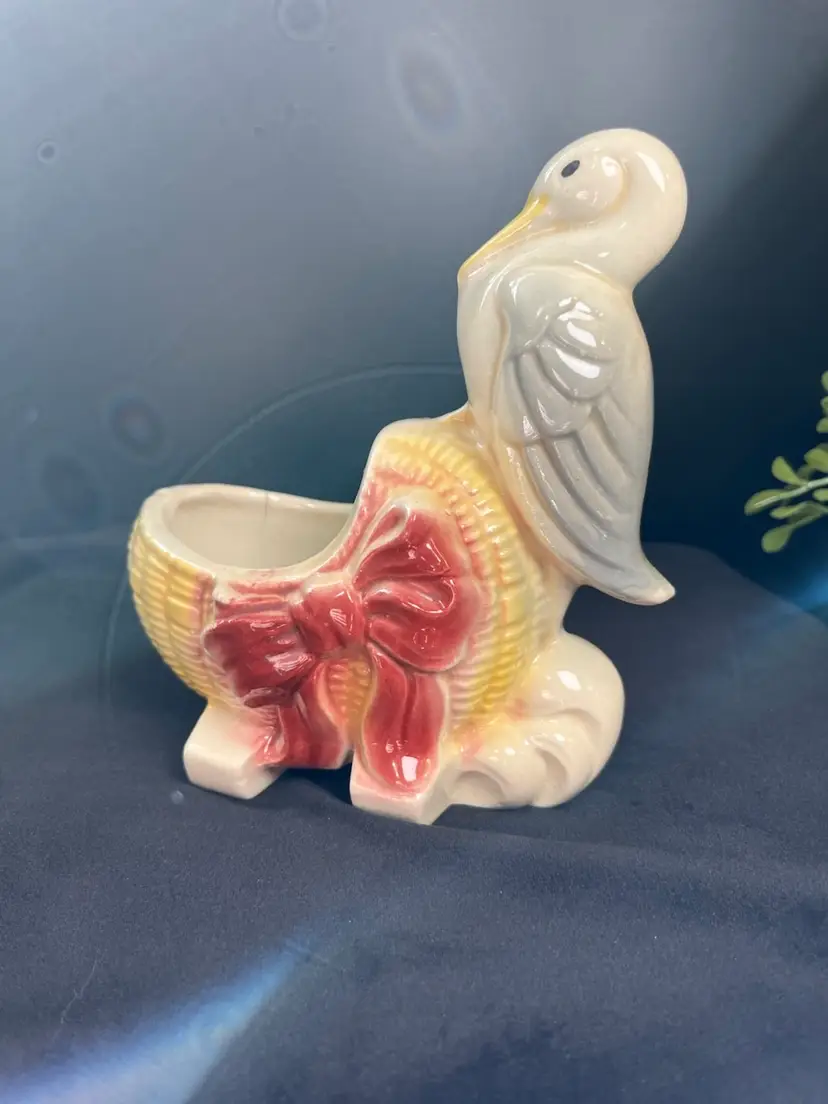 Mid Century Nursery Decor-Stork Perched on Yellow Wicker Style Baby Bassinet Adorned w/ a Ribbon