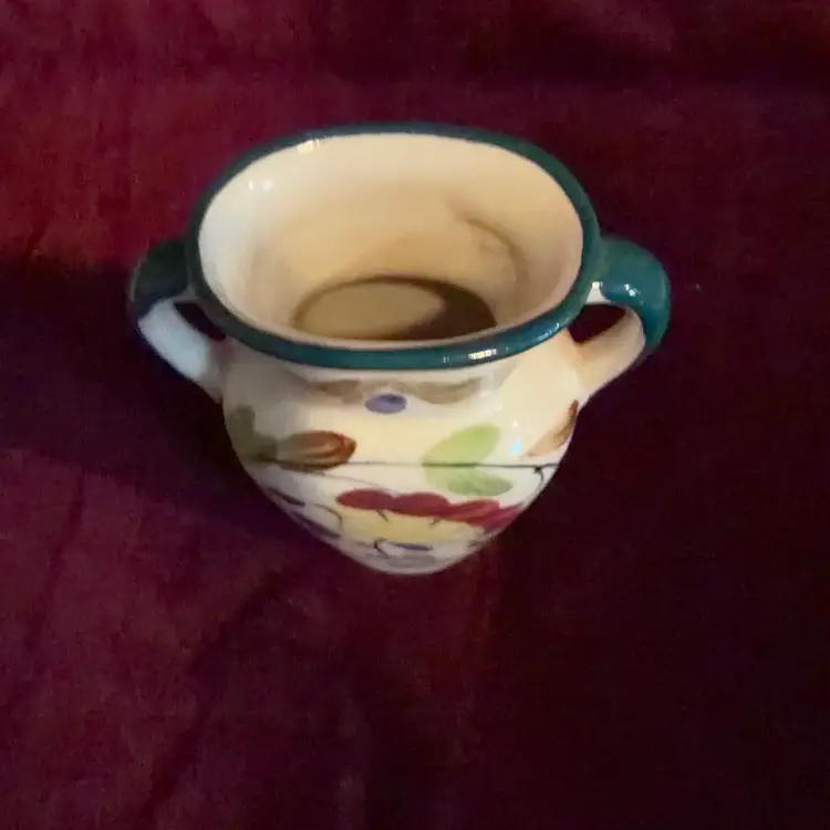 A Beautiful vintage hand-painted ceramic vase.  Japanese porcelain, featuring a floral design and double handles.