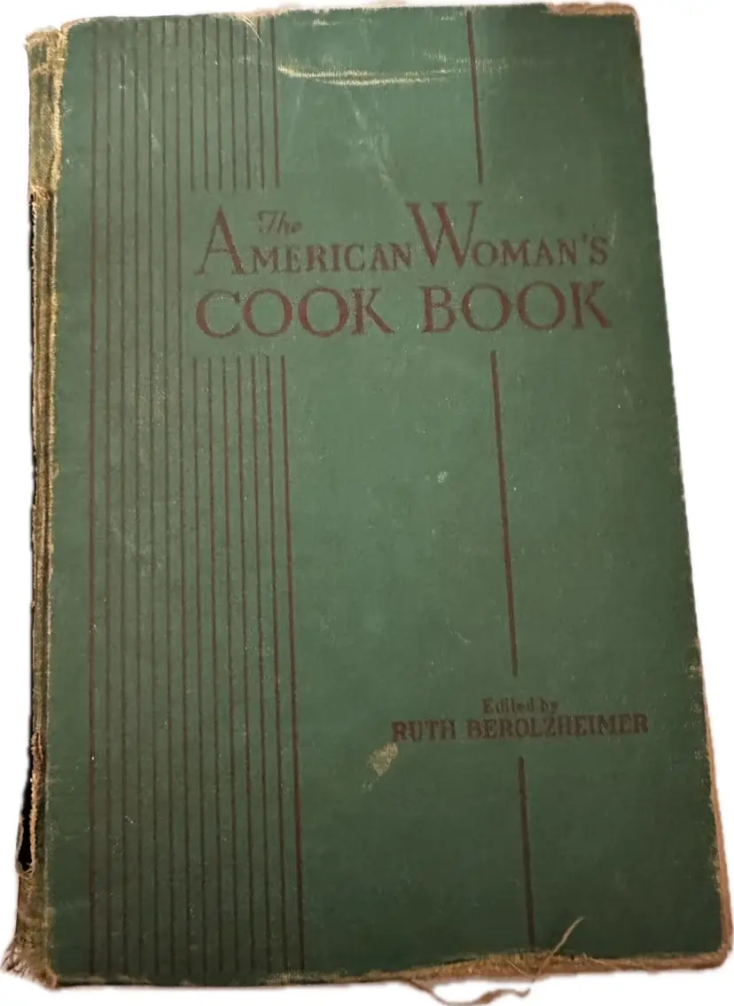 This vintage hardcover is "The American Woman's Cook Book", edited by Ruth Berolzheimer and originally published in the late 1930s or early 1940s.