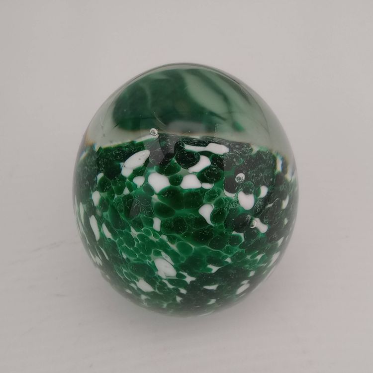 Green and white speckled egg paperweight