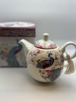 “Tea For One” Porcelain Teapot And Cup Peacock With Butterfly Design Teapot Is 4”, Cup 2.25”. Box Is 6”x6”.