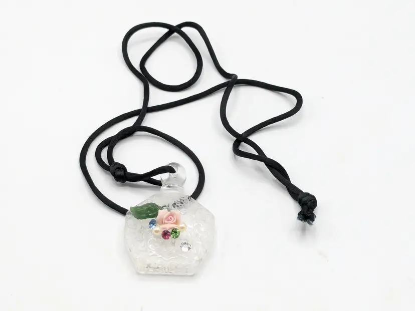 Glass Perfume Bottle Pendant with Floral Design on Black Cord Necklace