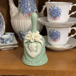 Green Wedgewood bell with ivory applied flowers