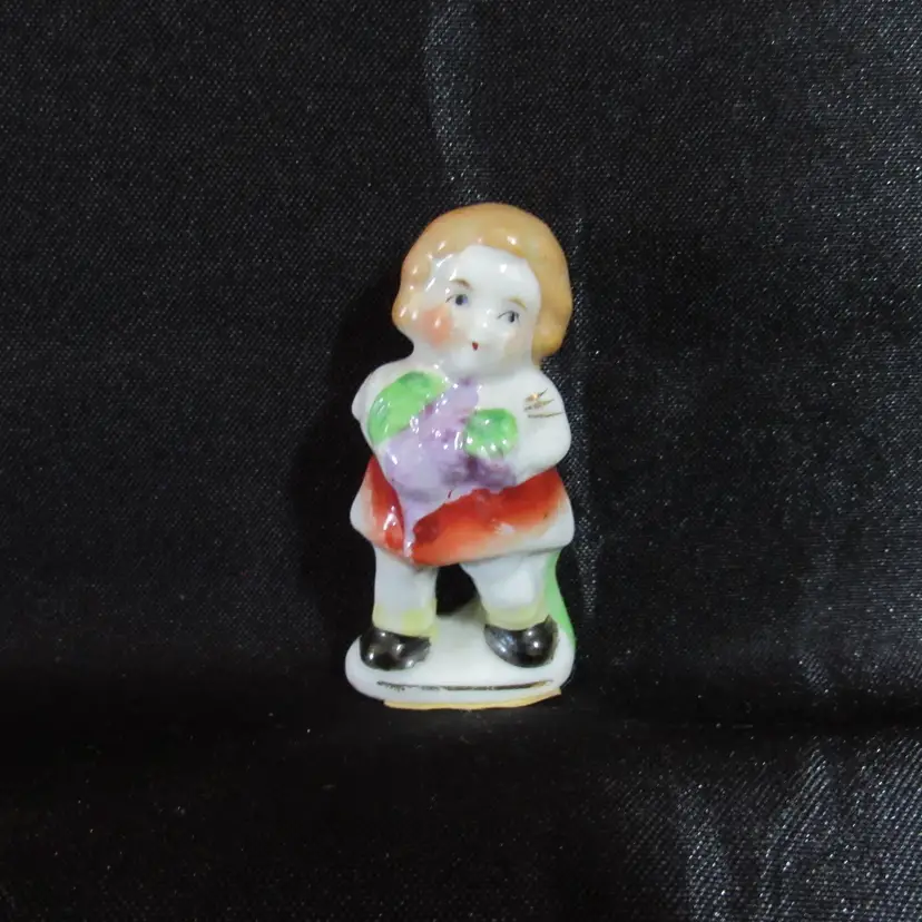 Occupied Japan Little Girl Holding Grapes Figurine