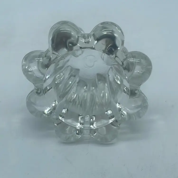 #0819 Clear glass fluted rim candle holder with multiple small feet.