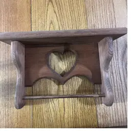 A rustic wooden shelf with carved hearts and a towel rod. 14”x8.5 “