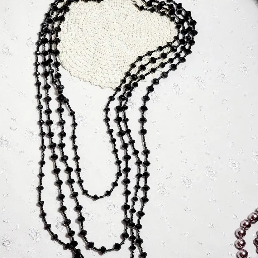 Multi strand, faceted black glass necklace with push in clasp