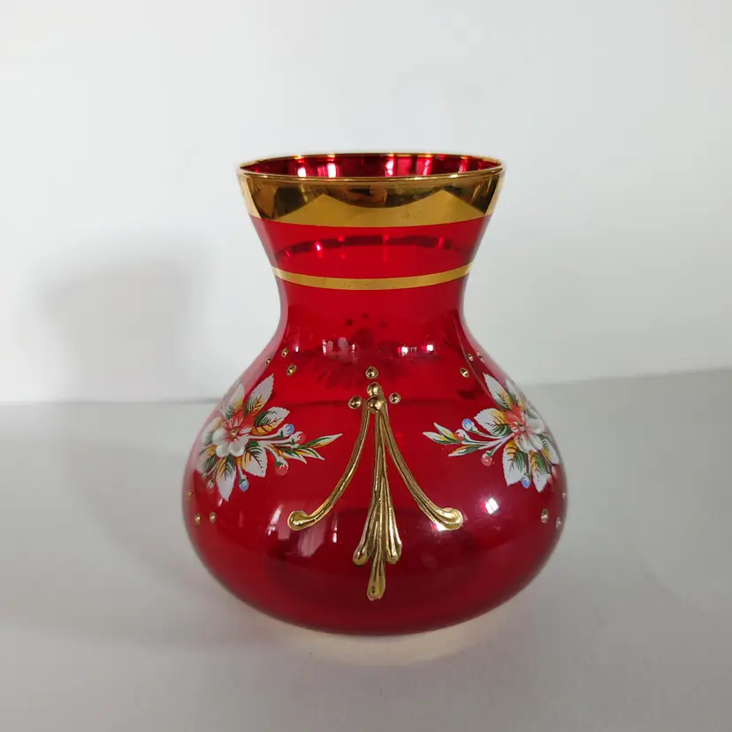 Bohemian Ruby Red Vase. Gold gilding and hand painted floral decoration. 4 inches high. No chips or cracks.