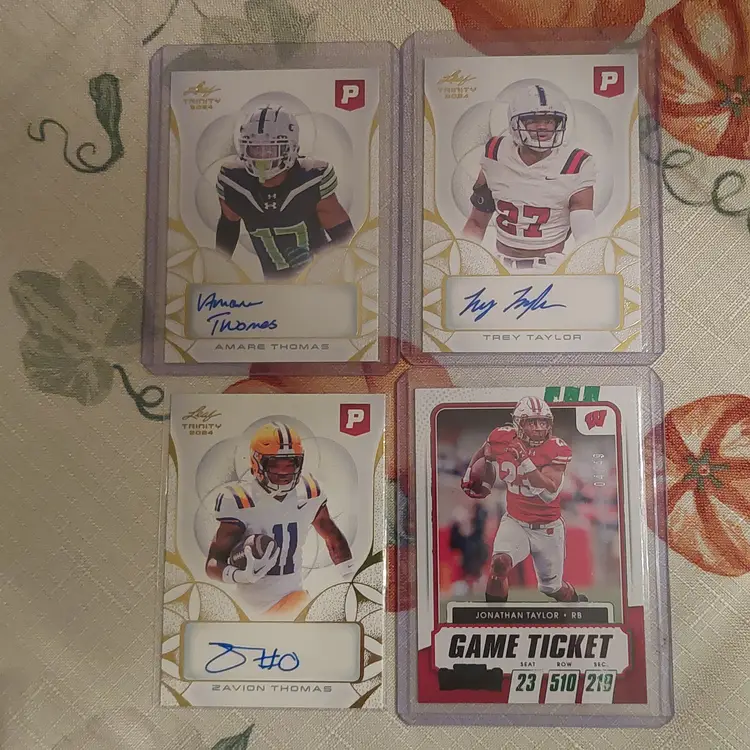 Lot of 10 college football cards. 3 auto's, 1 #'d, +. Letter T.