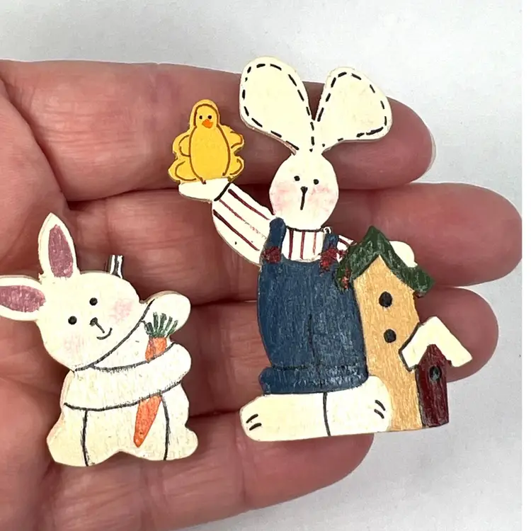 2 Bunny 🐰 Hand-Painted Wooden Pins. One Holding a Little Chick 🐥 & One Hugging Favorite Snacking Carrot 🥕. Perfect for Easter.