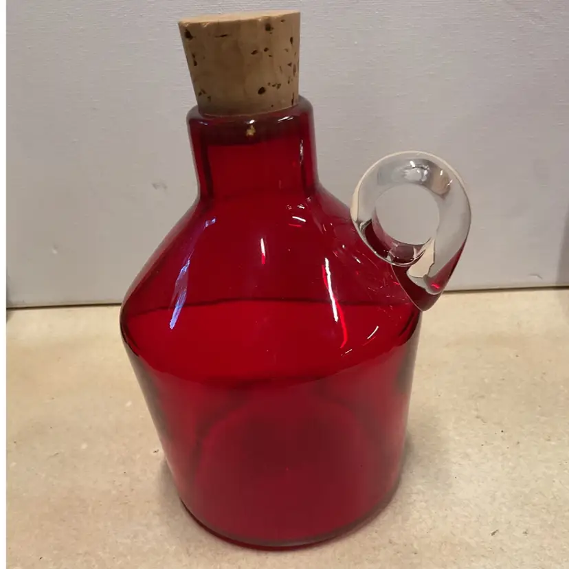 Red art glass Moonshine bottle