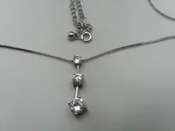 Avon silver plate dangle necklace with 3 Faux diamonds