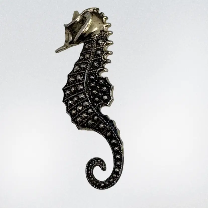 Vintage seahorse brooch with marcasite-like stones.