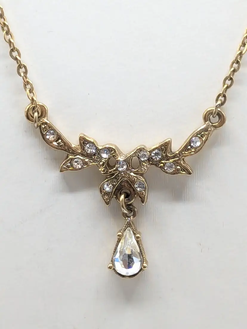 Vintage 1928 Jewelry Gold Tone Rhinestone Bow Teardrop Pendant Necklace