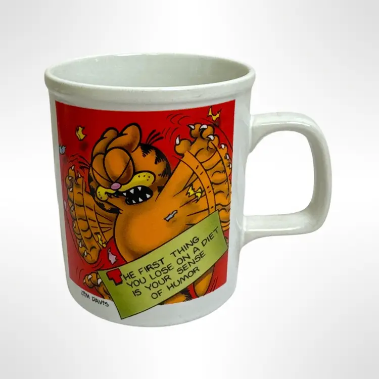 Vintage Garfield Coffee Mug 
“The First Thing You Lose On A Diet Is Your Sense Of Humor”