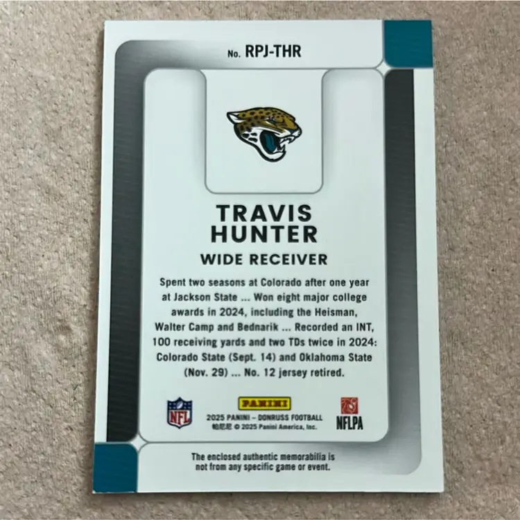 2025 Panini Donruss Rookie Phenom Jersey card featuring Travis Hunter (card number RPJ-THR).