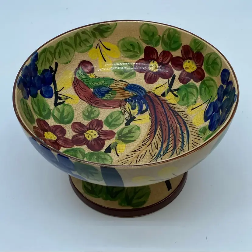 #1607 Hand-painted ceramic bowl with bird and floral design on a pedestal.