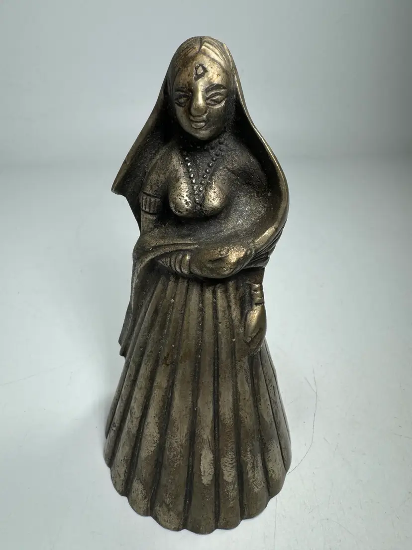 Vintage pewter or brass Figal handbell of a woman from India and traditional dress