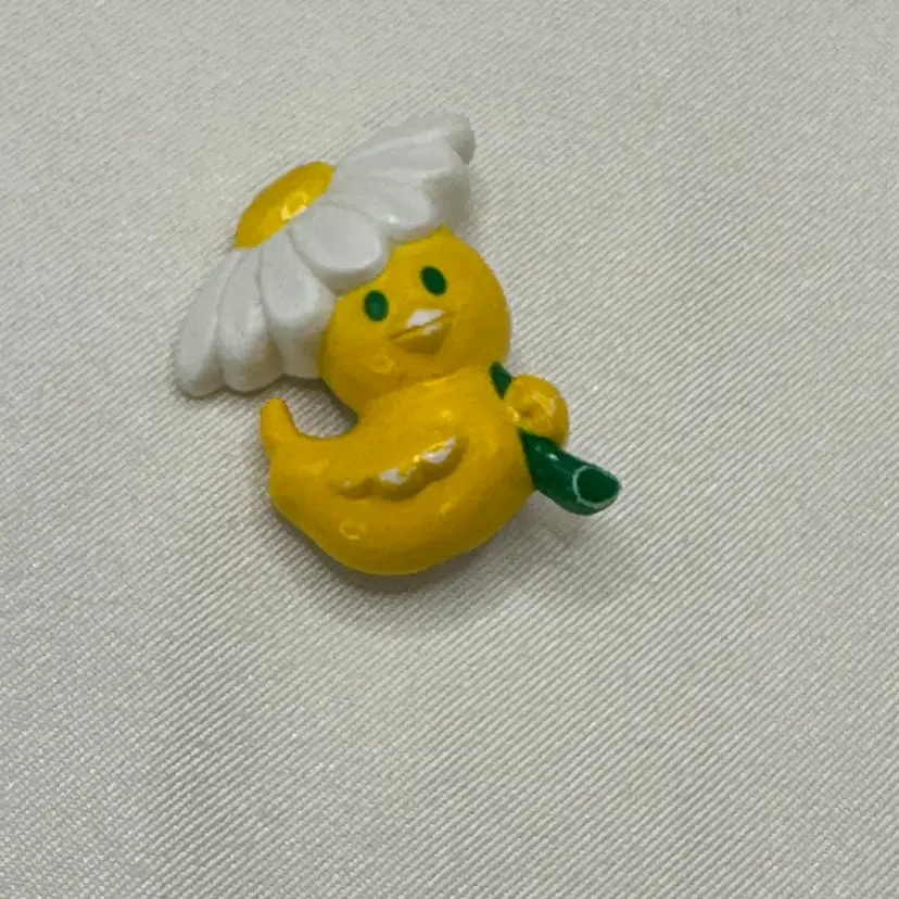 A057 - Avon Duckie With Flower Umbrella Brooch
