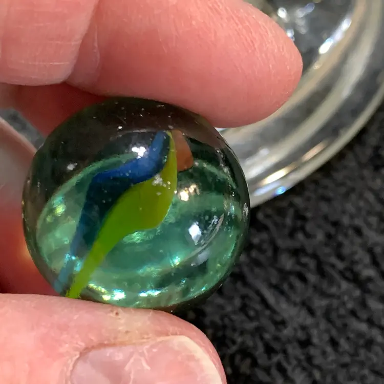 Clear w/Orange, Yellow & Blue Swirl Glass Marble 1"