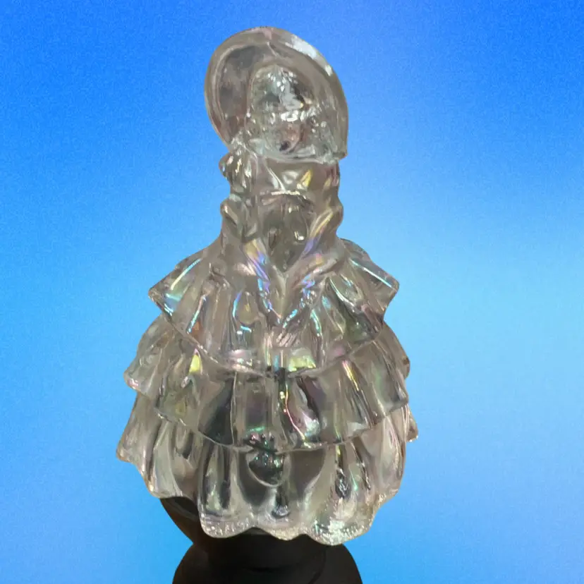 Wheaton iridescent carnival glass figurine of a woman in a ruffled dress. 5.5”