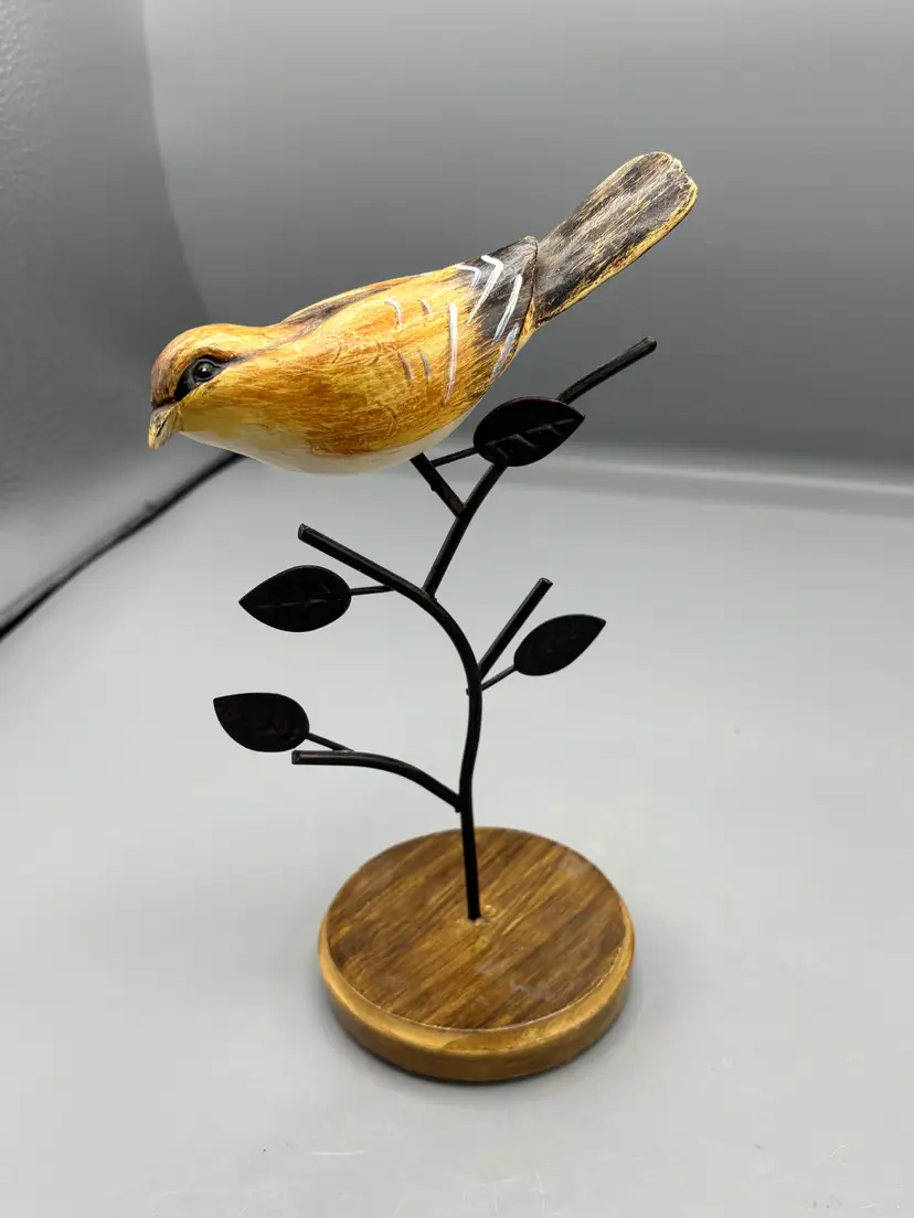 Carved Wren bird on metal branch