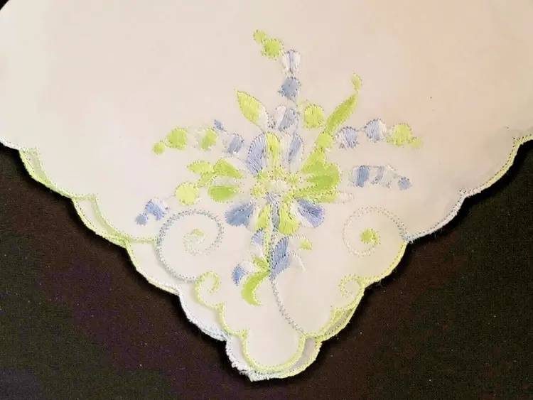 Floral Handkerchief Embroidered with nice edge treatment folded & creases