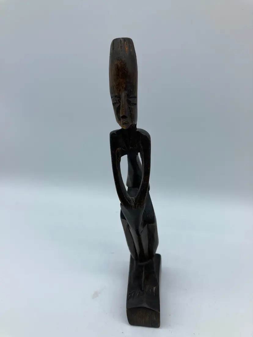 Small wooden carving of an African man