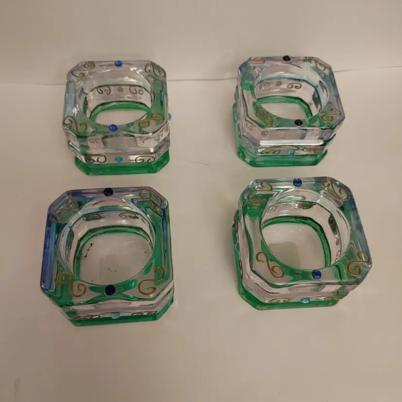 Party Lite set of 4 tea light holders. Mardi Gras pattern. 1 is missing 2 stones. 2.5 x 2.5 x 1.5 high.