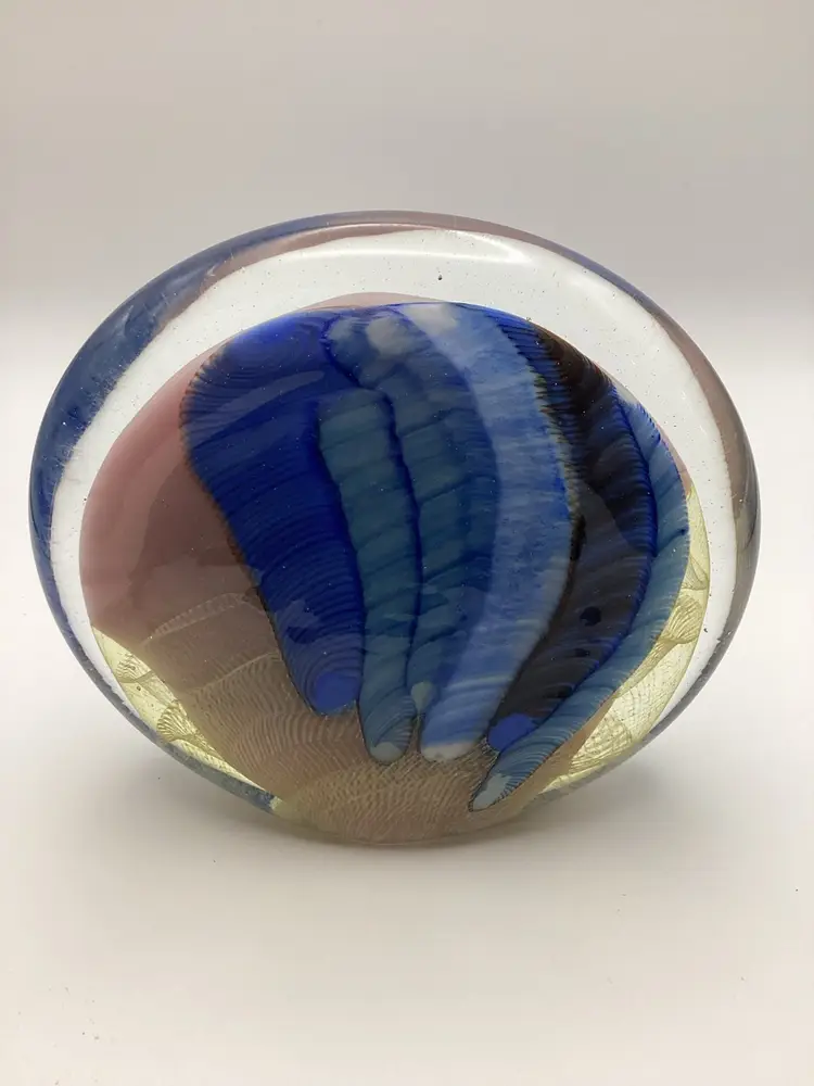 Art glass in pink, blue & black oval shaped paperweight signed by Paul Bendzunas
