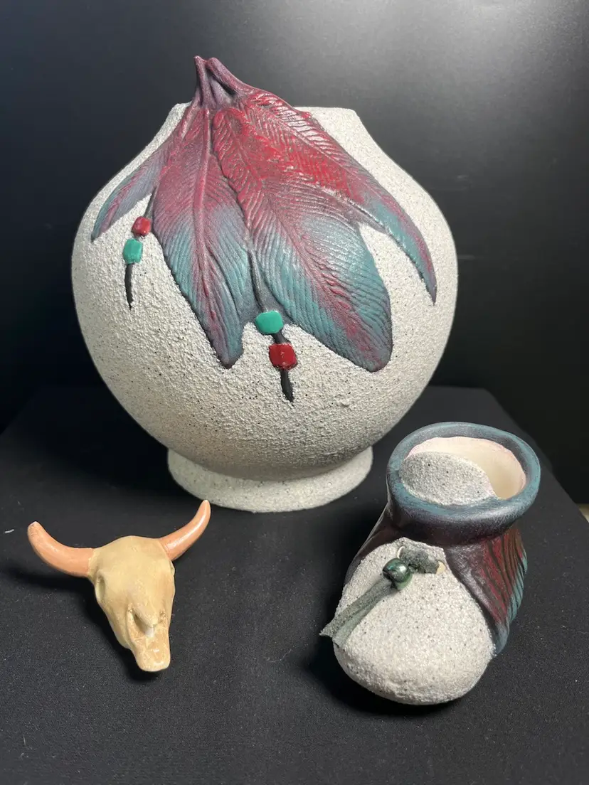 Ceramic Native American Vignette-Planter w/ Beautifully Painted Feathers, Small Child's Moccasin w/ Painted Feathers,Leather tie & Bead, & Cow Skull. Lot 44