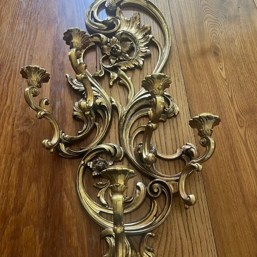 Ornate gold-finished Homco wall candelabra with five candle holders. -PLASTIC 33x17”