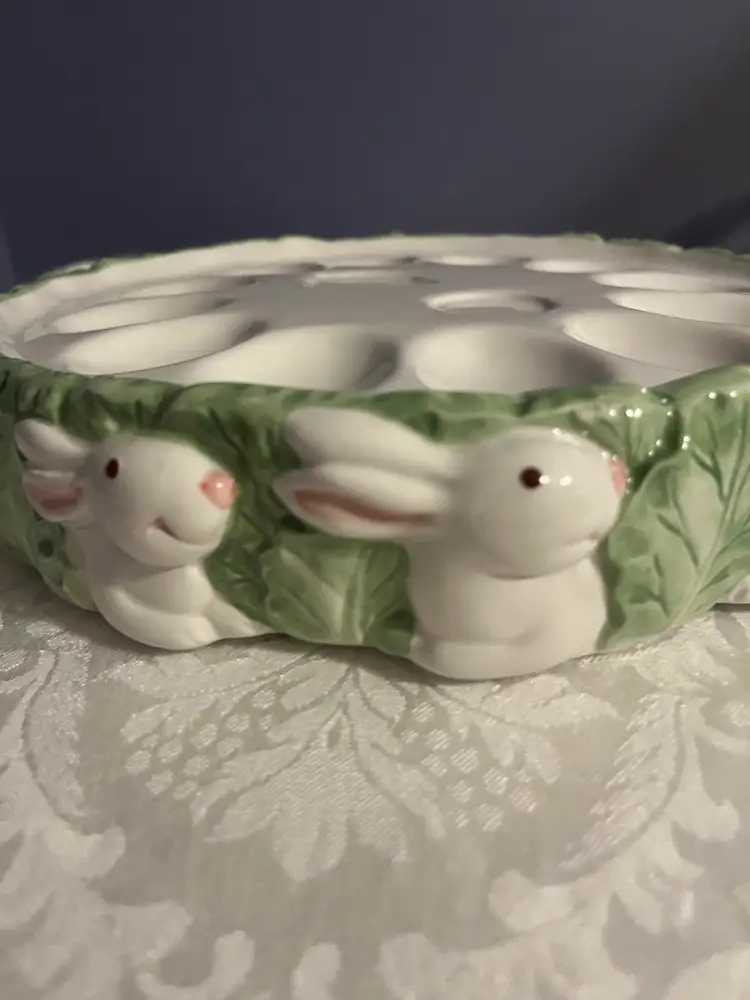 Ceramic Easter deviled egg plate with bunnies and leafy trim. -10”