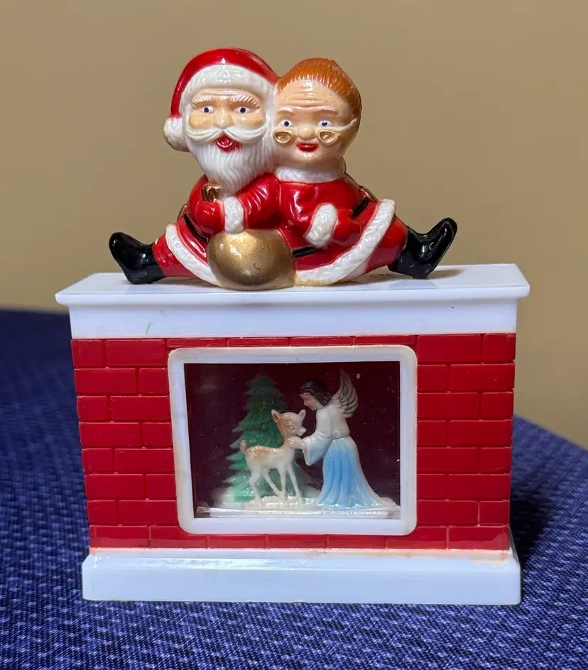 Christmas fireplace diorama Mr. and Mrs. Claus on top angel and deer inside