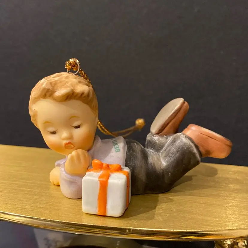 Berta Hummel Goebel Boy Laying Down With Gift Ornament