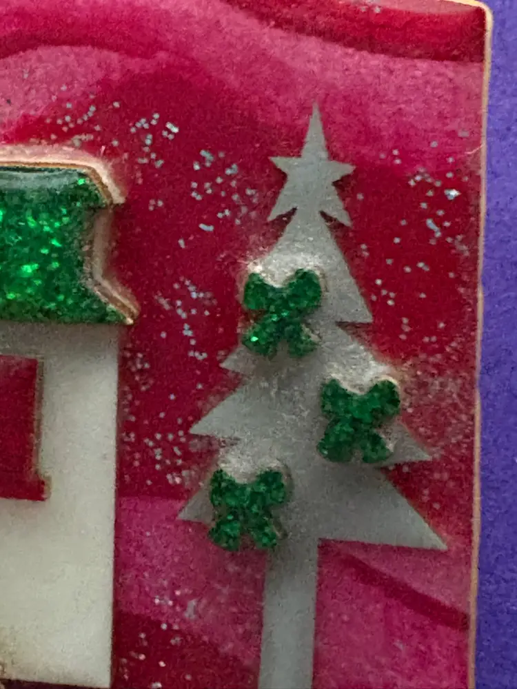 Christmas Lucinda House Pin - Hard To Find ~ Red Swirly Glitter Background.  Tree Decorated With Green Bows. Houses Have Green Glittery Rooftops! Skis And Poles Leaning On The House.