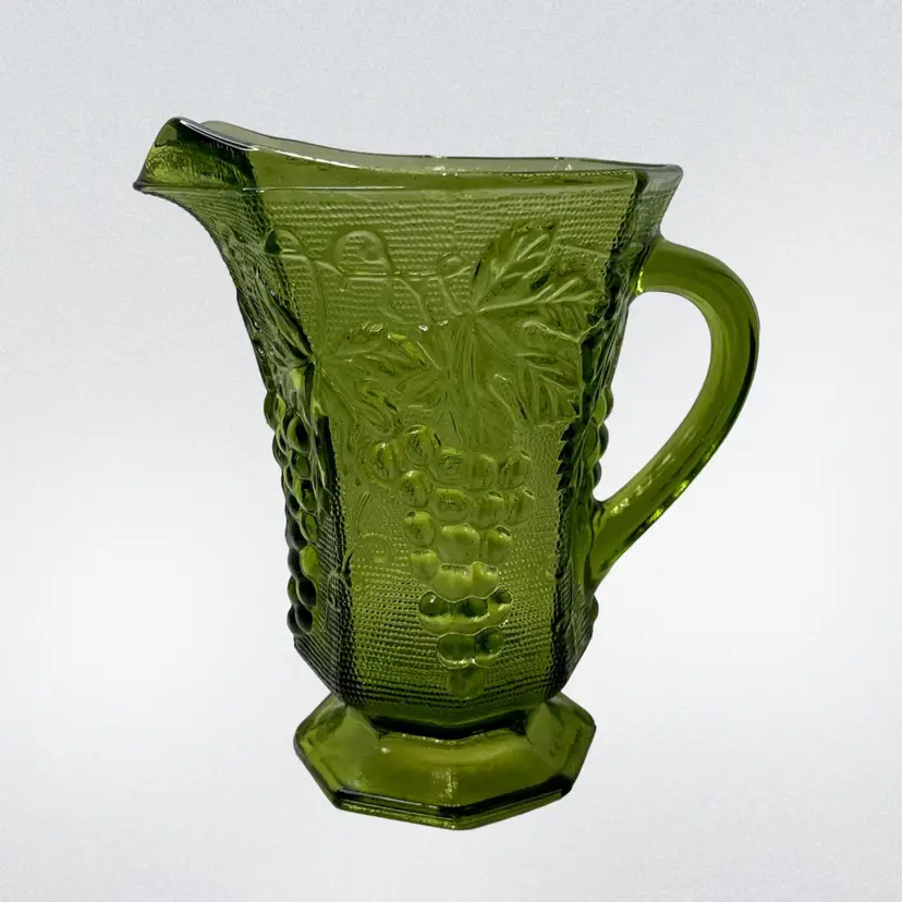 Anchor Hocking Green Glass Pitcher With Grape Leaf Panel 16oz
7-3/4” T